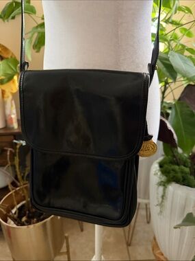 Brahmin Black Leather Messenger Bag with Gold Medallion